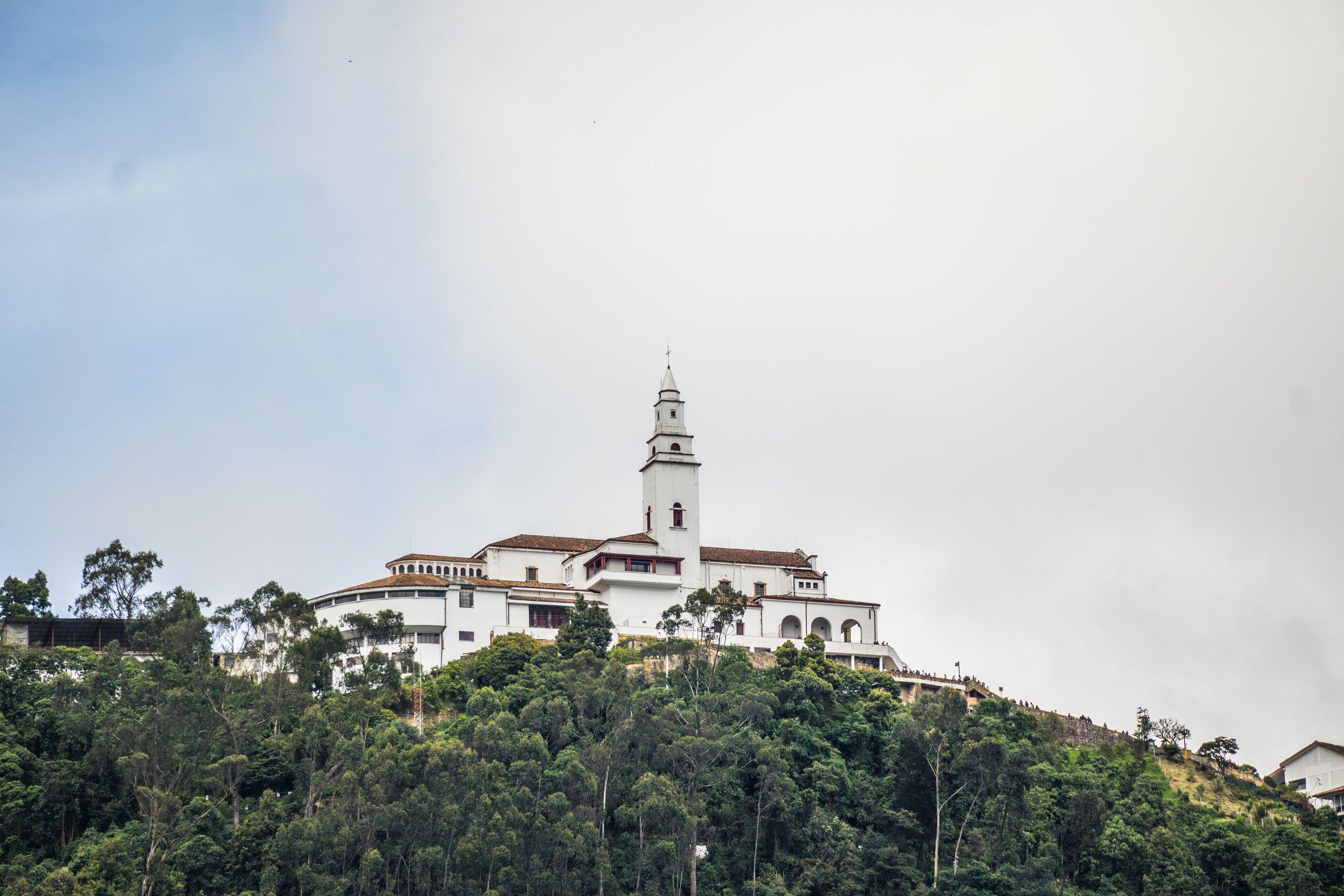 The white Monserrate sanctuary on top of the green hill overlooking Bogotá