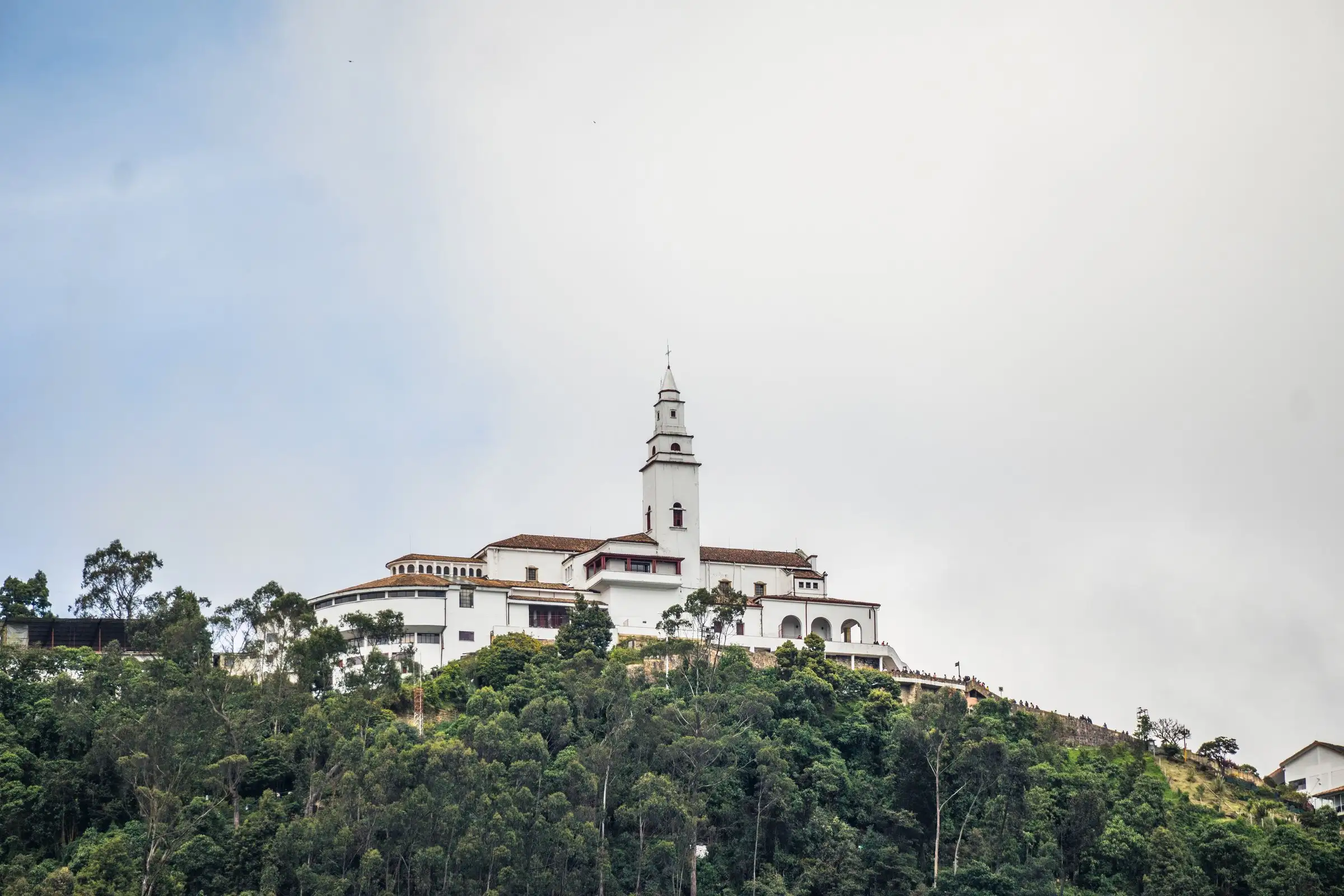 The white Monserrate sanctuary on top of the green hill overlooking Bogotá