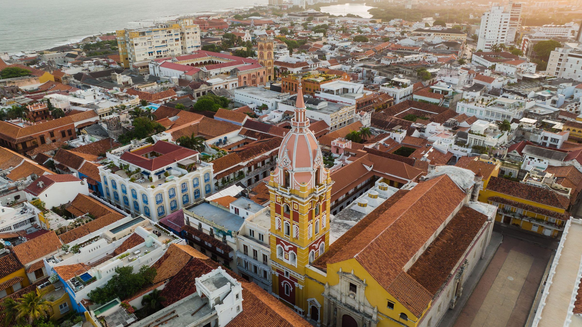 Aerial view of Cartagena's old town with the cathedral, red-tiled roofs and the sea in the background